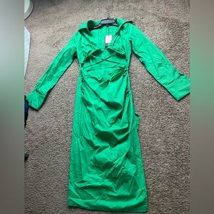 Selling long sleeve green dress , with cut outs in breast area very pretty